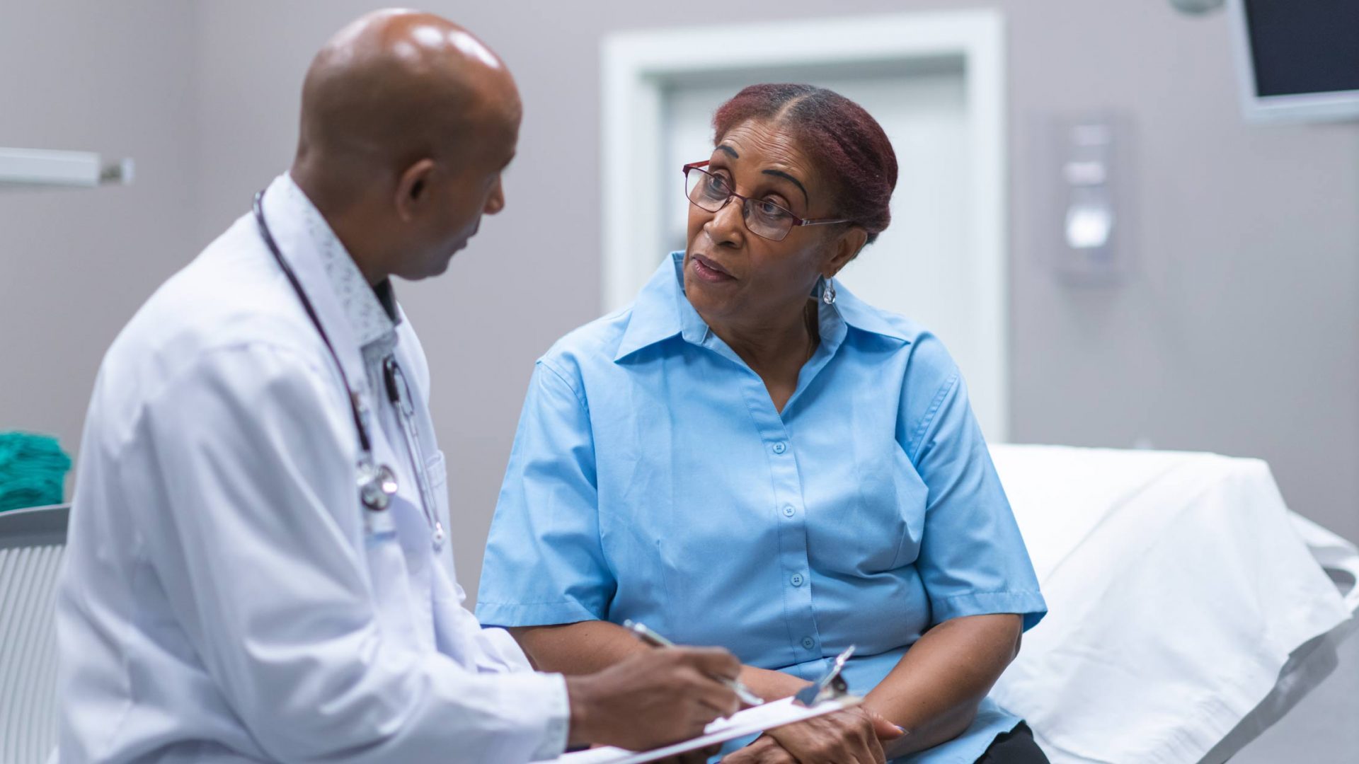 Doctor Speaking with Patient