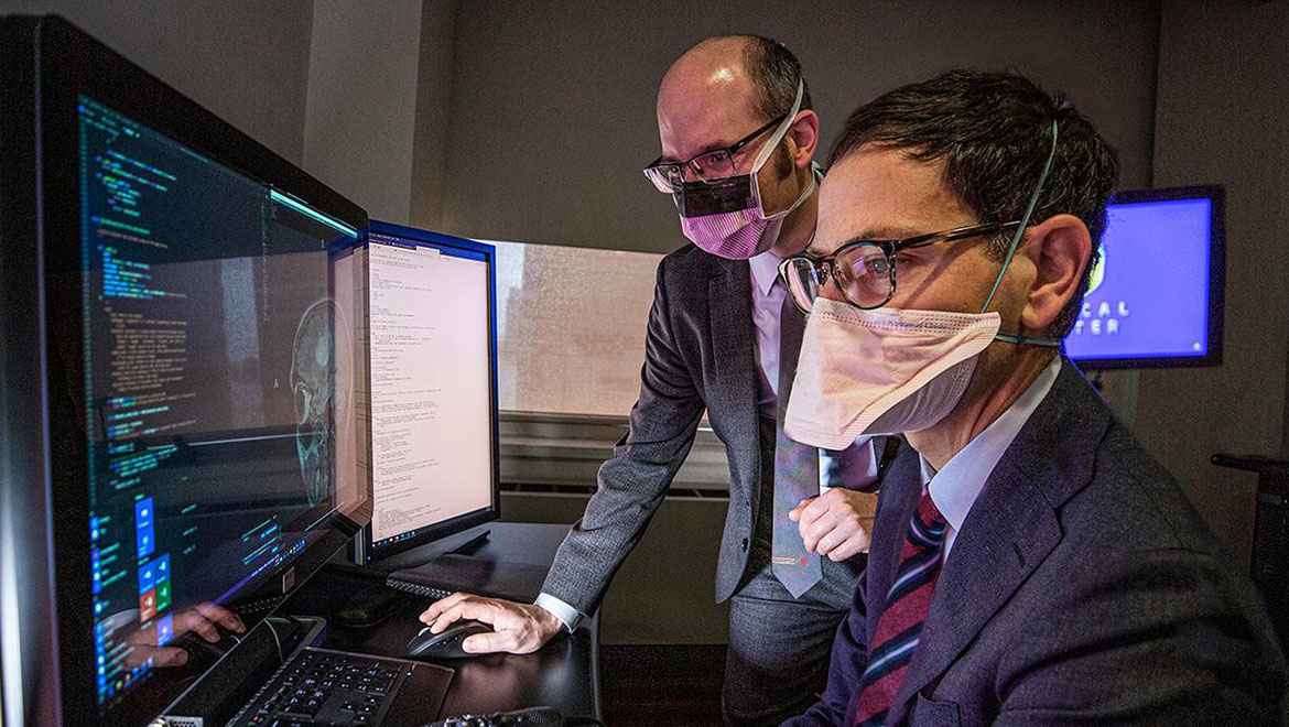 Dr. Daniel A. Orringer and Dr. Eric K. Oermann, MD Viewing Brain Images