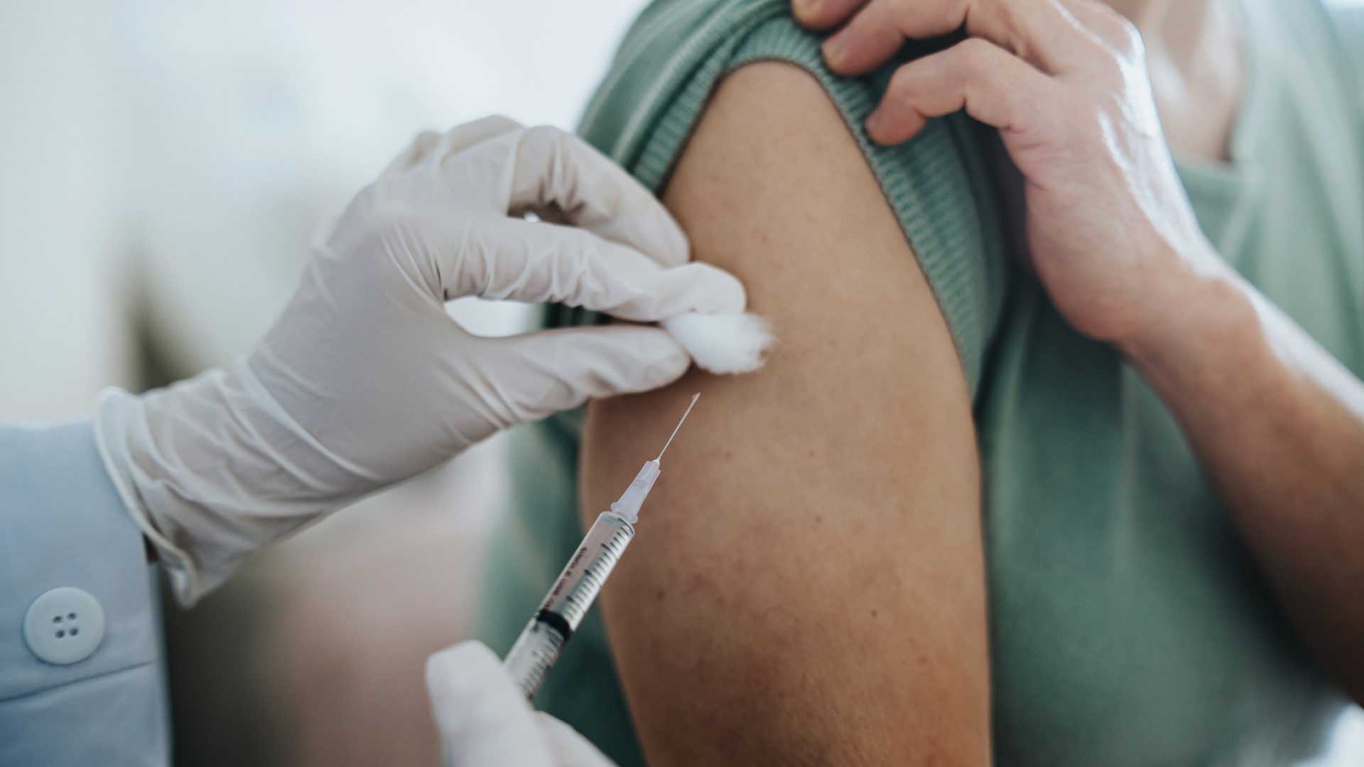 Receiving a Vaccine via Injection in Their Arm