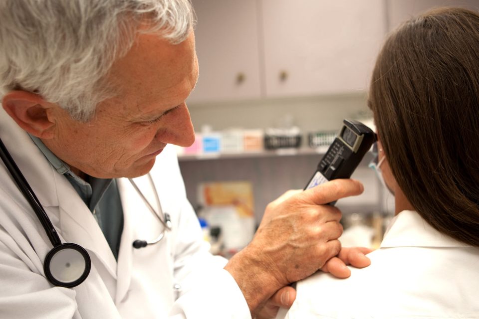 Doctor Examining Patient’s Ear