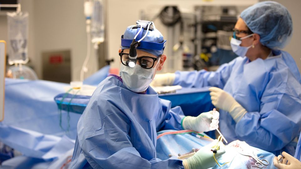 Dr. Daniel A. Orringer and Team Performing Neurosurgical Procedure in Operating Room
