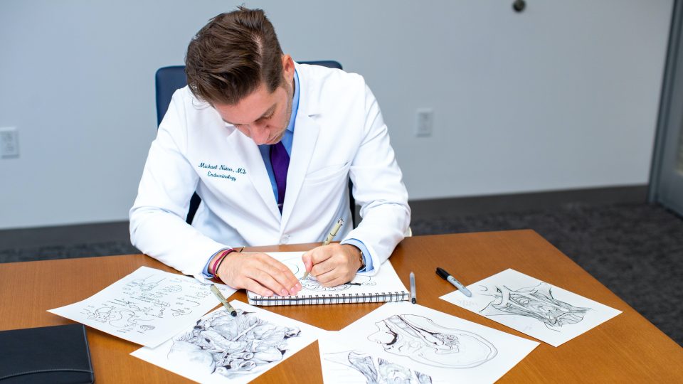 Endocrinologist Dr. Michael Natter using art to help explain treatment to patients