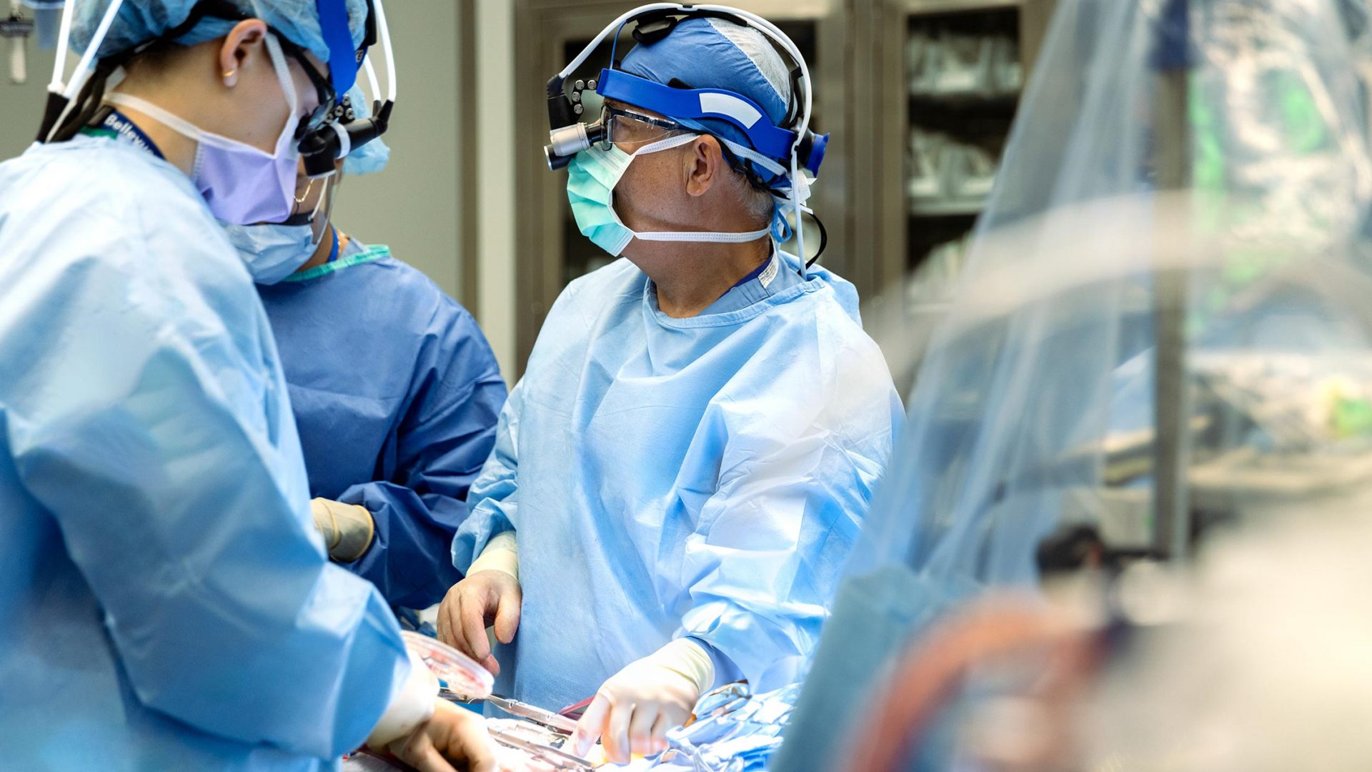 Dr. Elias A. Zias and team performing coronary artery bypass grafting in operating room.