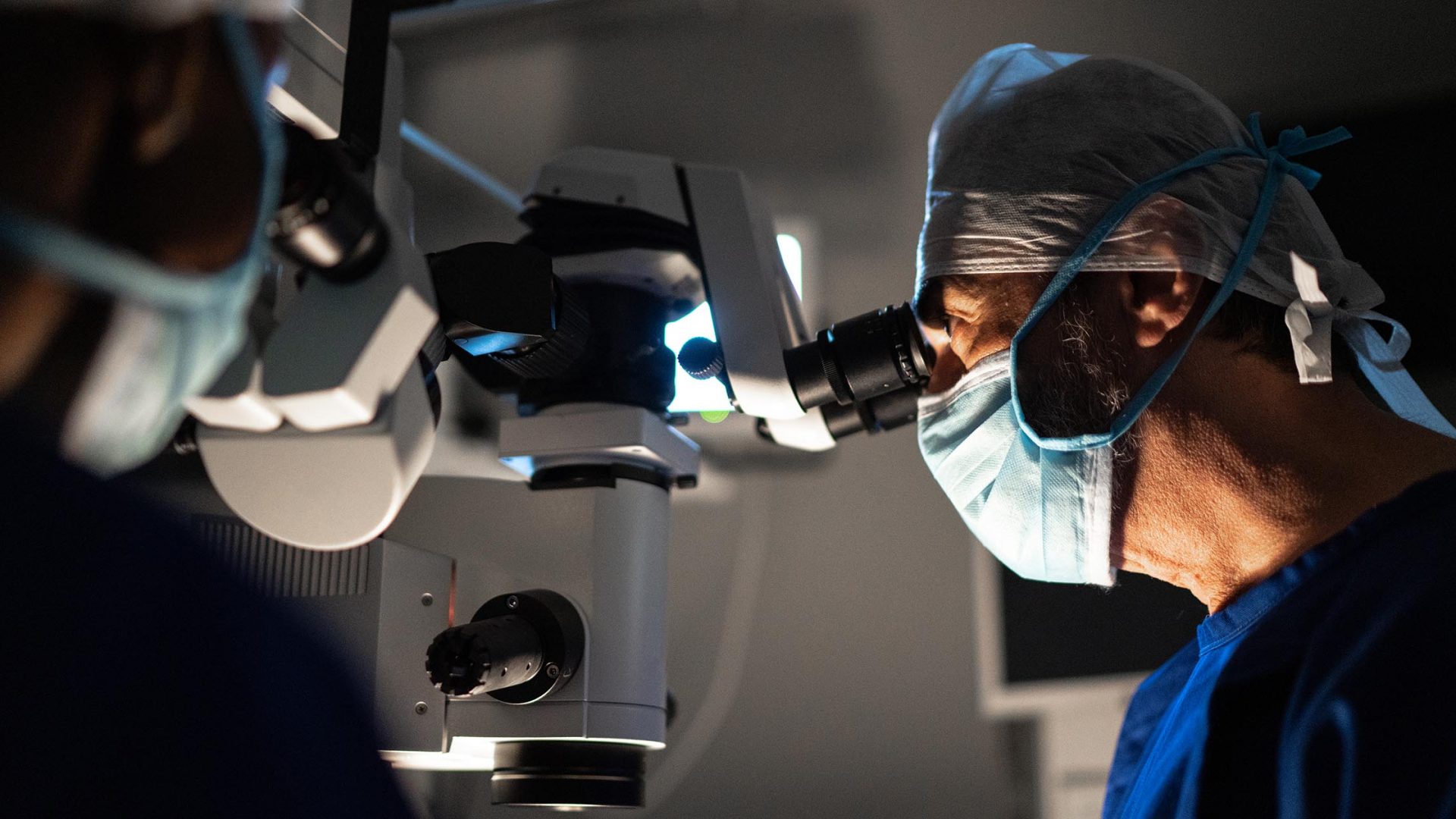 An Ophthalmologist Using Microscope in Operating Room