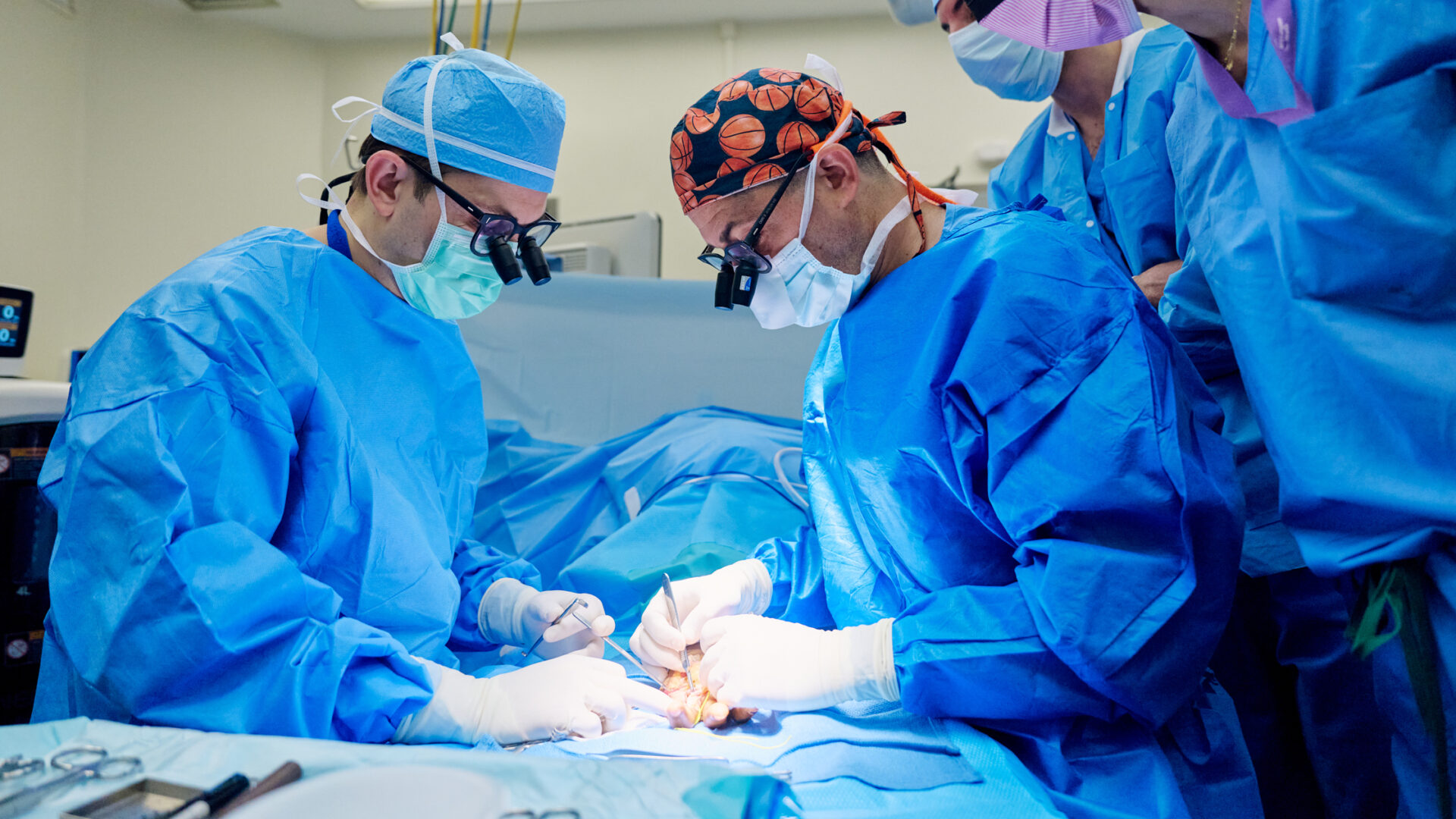 Jacques H. Hacquebord, MD (left) and Omri B. Ayalon, MD (right) in surgery.